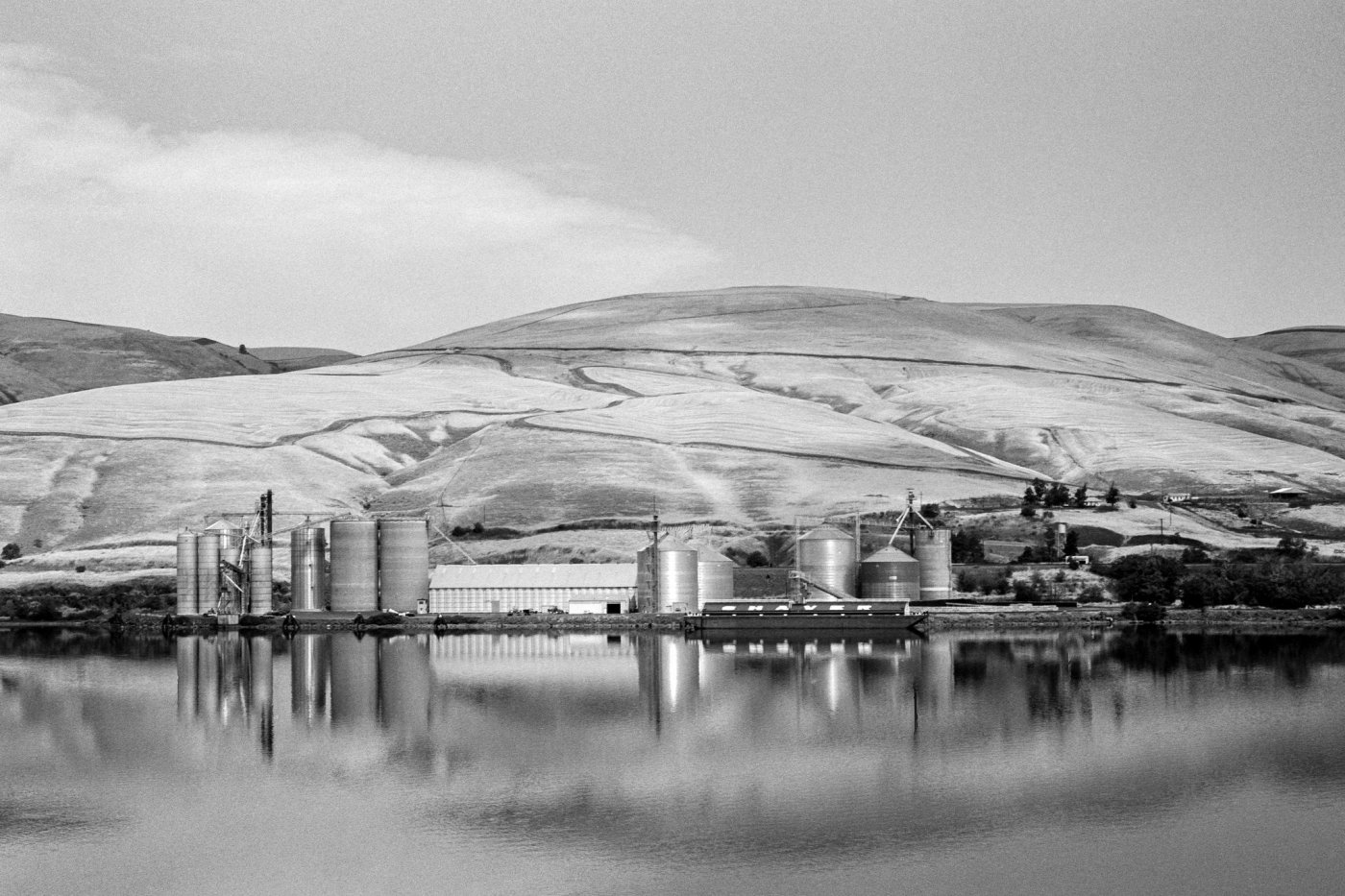 Black and white photo by ‏@jefferydross Aug 10 "Wheat Barge" Snake River, Washington Leica M6 @ILFORDPhoto fp4+